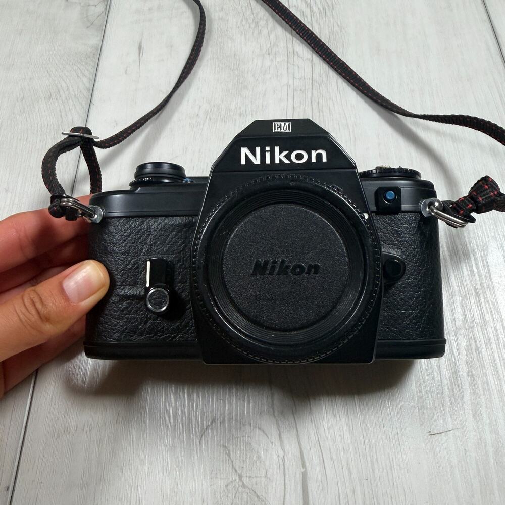 Nikon EM 35mm Film SLR Camera Body, Black (Body Only) for parts or repair